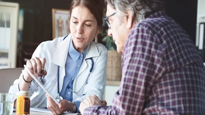 A male patient and a female doctor discussing the evaluation process and treatment programs for desoxyn addiction