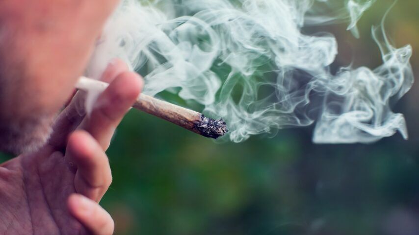 Man smokes a joint