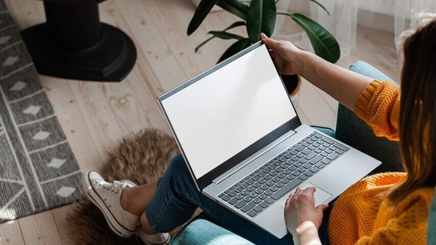 Young woman using laptop to work in a drug rehab center while waiting for her treatment