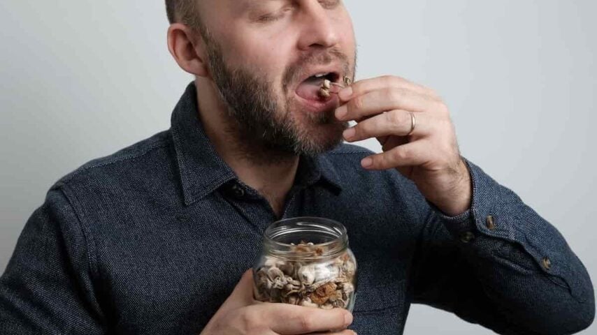 a man consuming psilocybin or magic mushrooms for euphoric effect